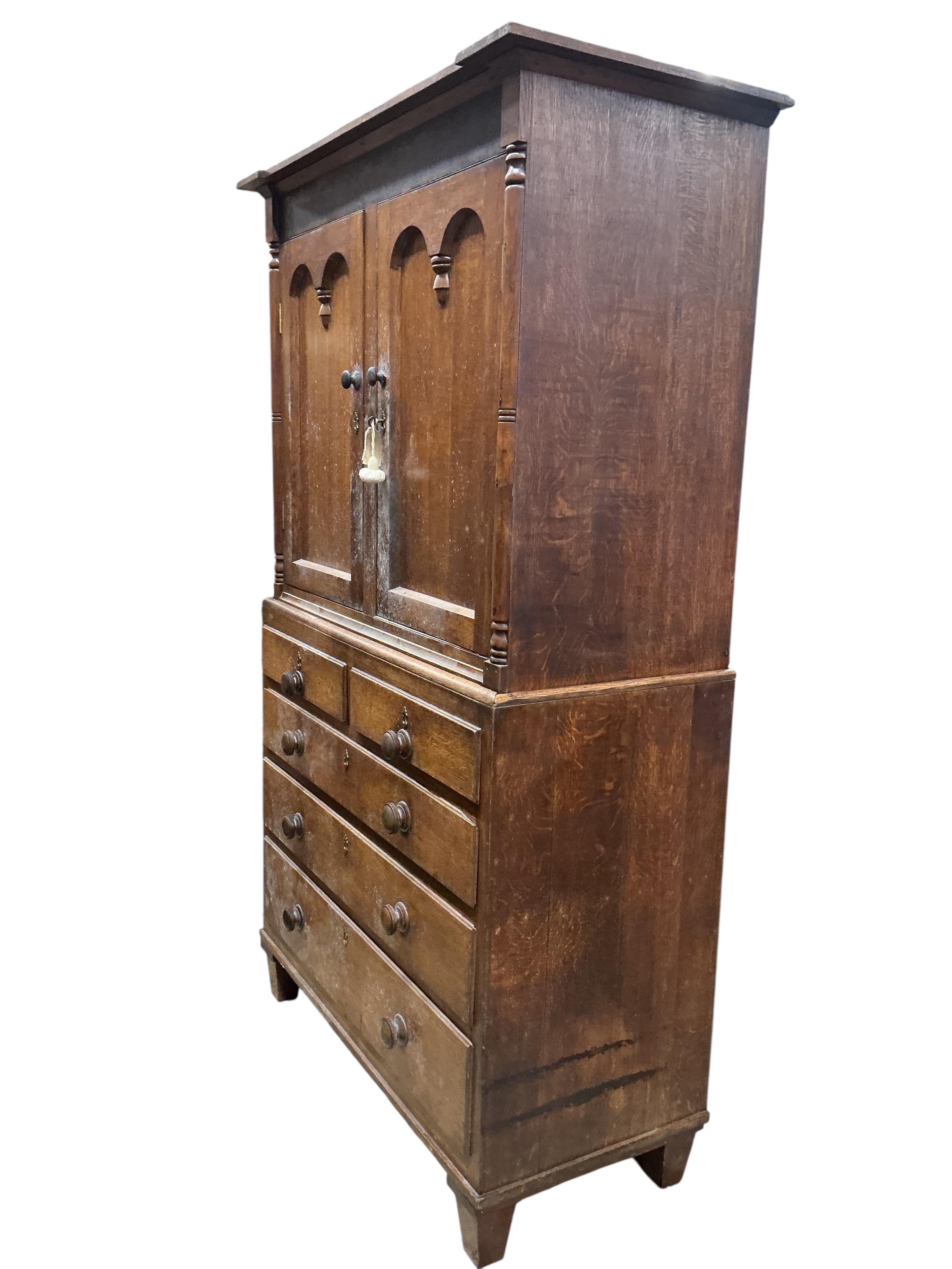 A 19th century oak press cupboard, width 117cm, depth 54cm, height 198cm
